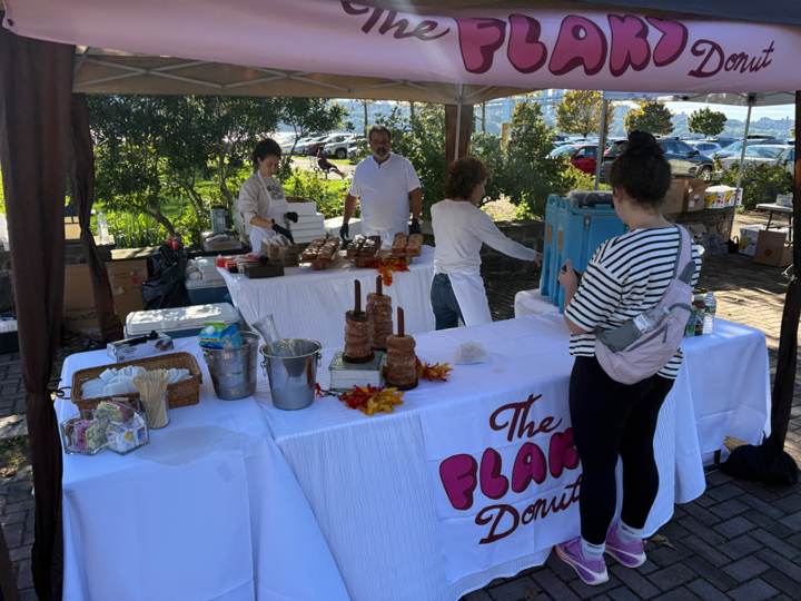 The Flaky Donut serving customers at an outdoor vendor event